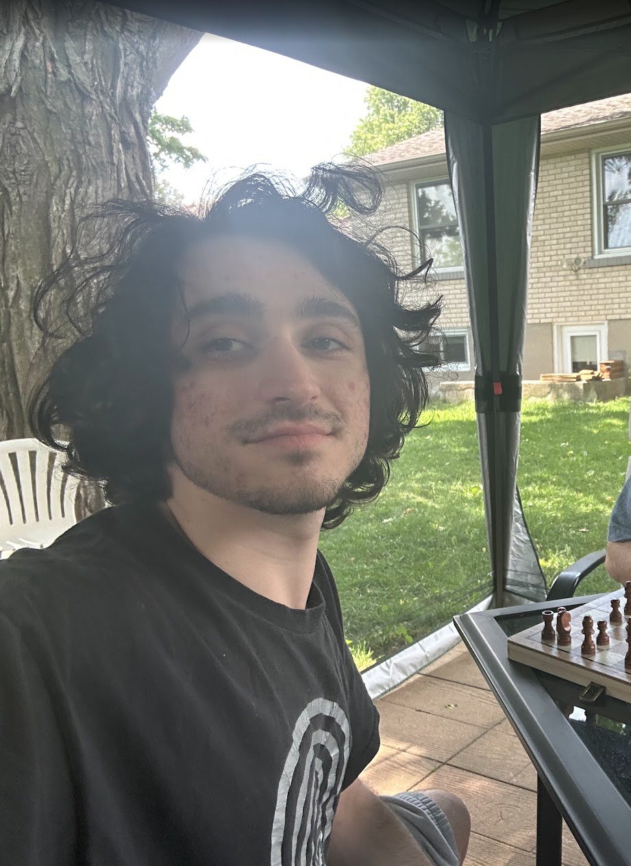 mel playing chess in the yard